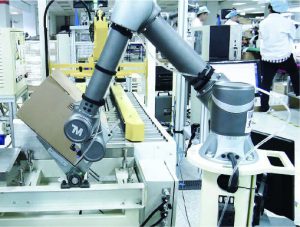 Techman Robot automating a packaging plant with gripper technology.