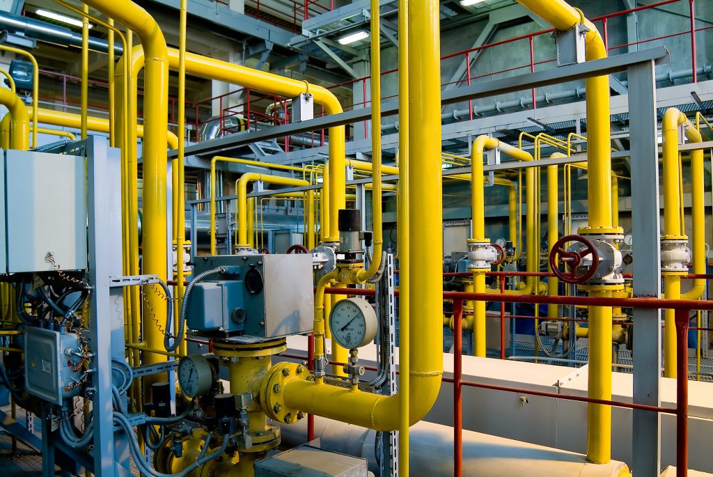 A compressed air system with yellow and red equipment.