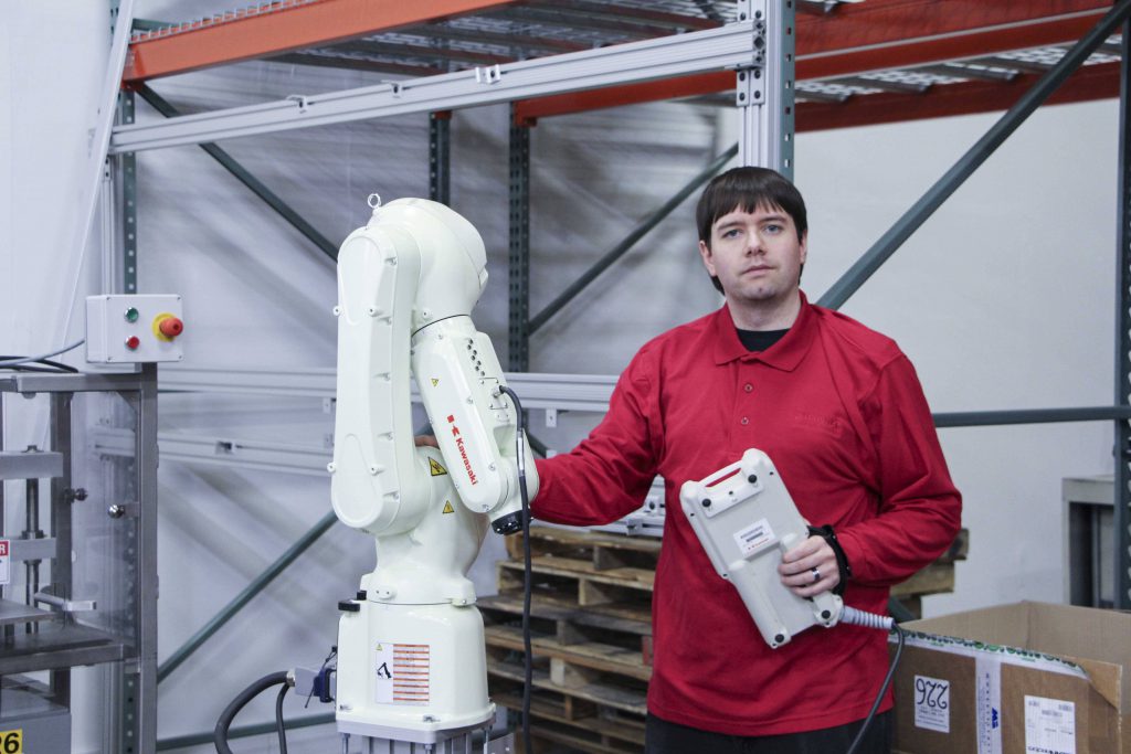 JHFoster engineer servicing a robot