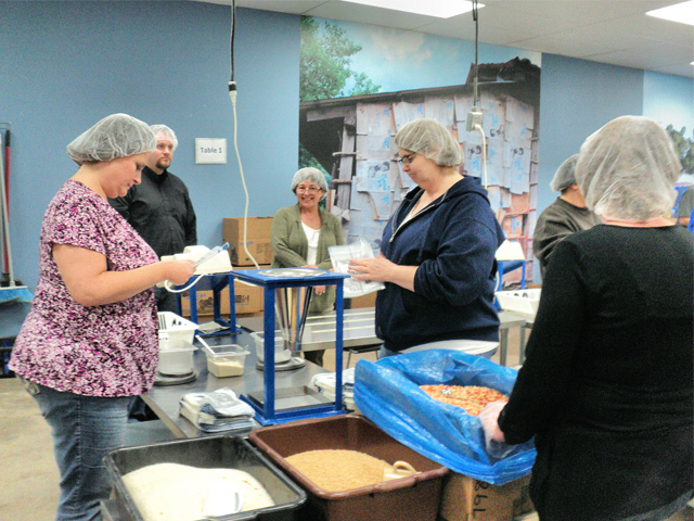 Employees Help With Feed My Starving Children Preparation