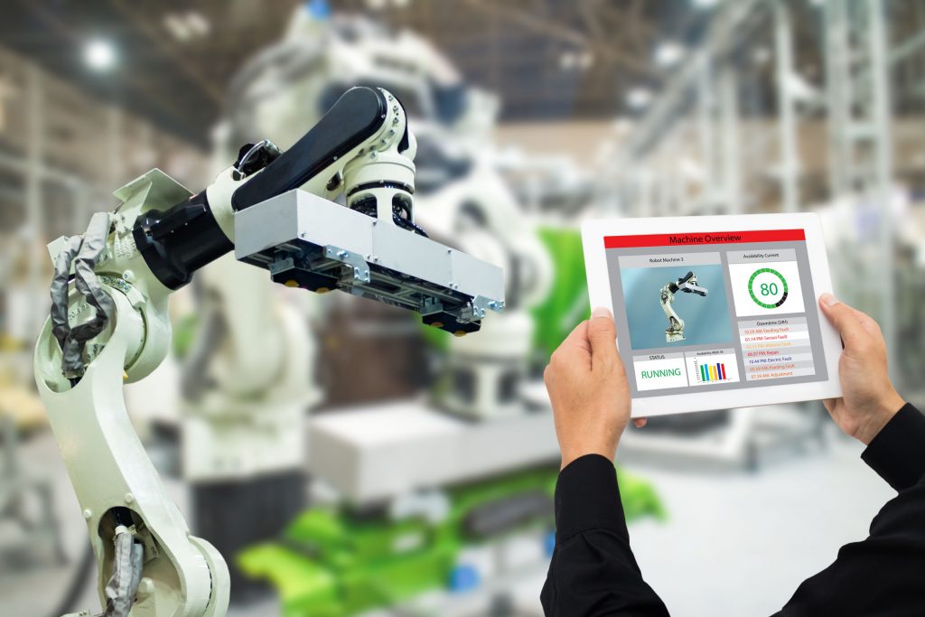 Man engineering a robot