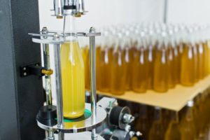 Filling bottle on production line using sensor technology