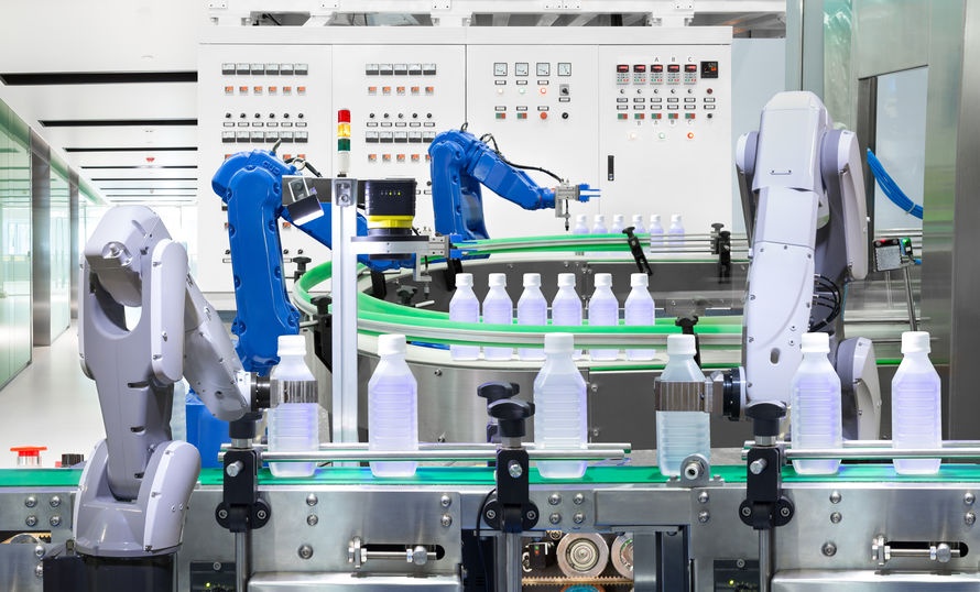 Robotic arm holding water bottles on production line in factory,