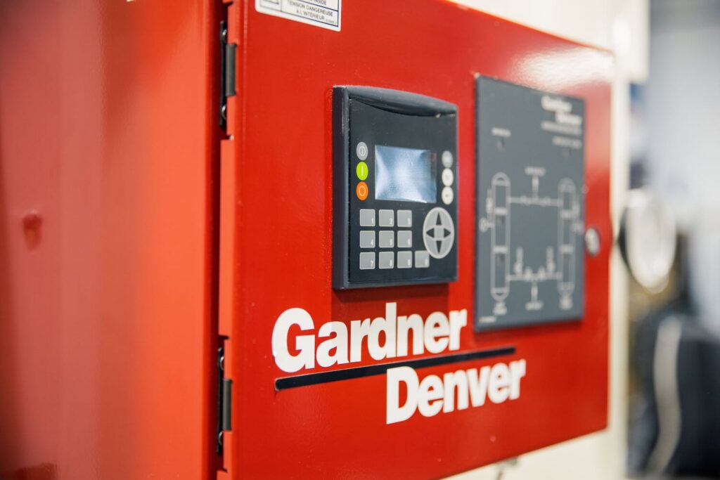 Close up of the Gardner Denver air compressor control panel
