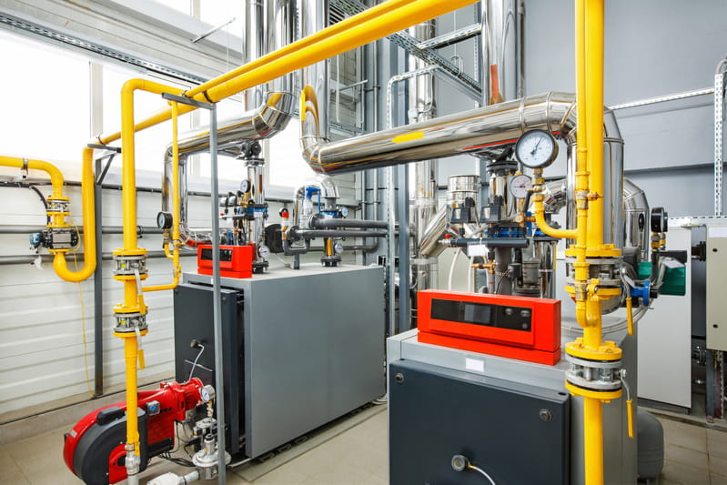 interior industrial boiler house with multitude pipes boilers sensors